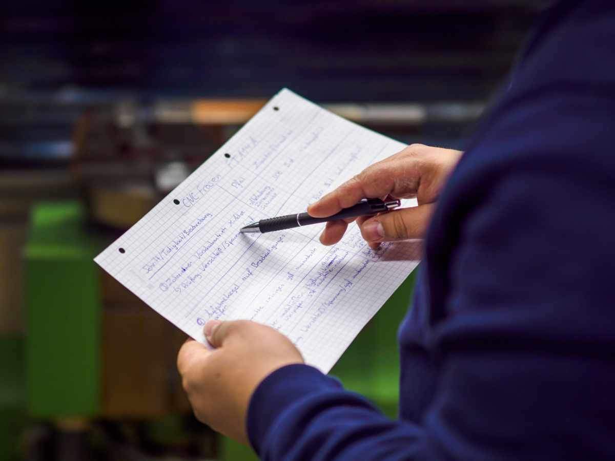 A participant holding a paper instruction